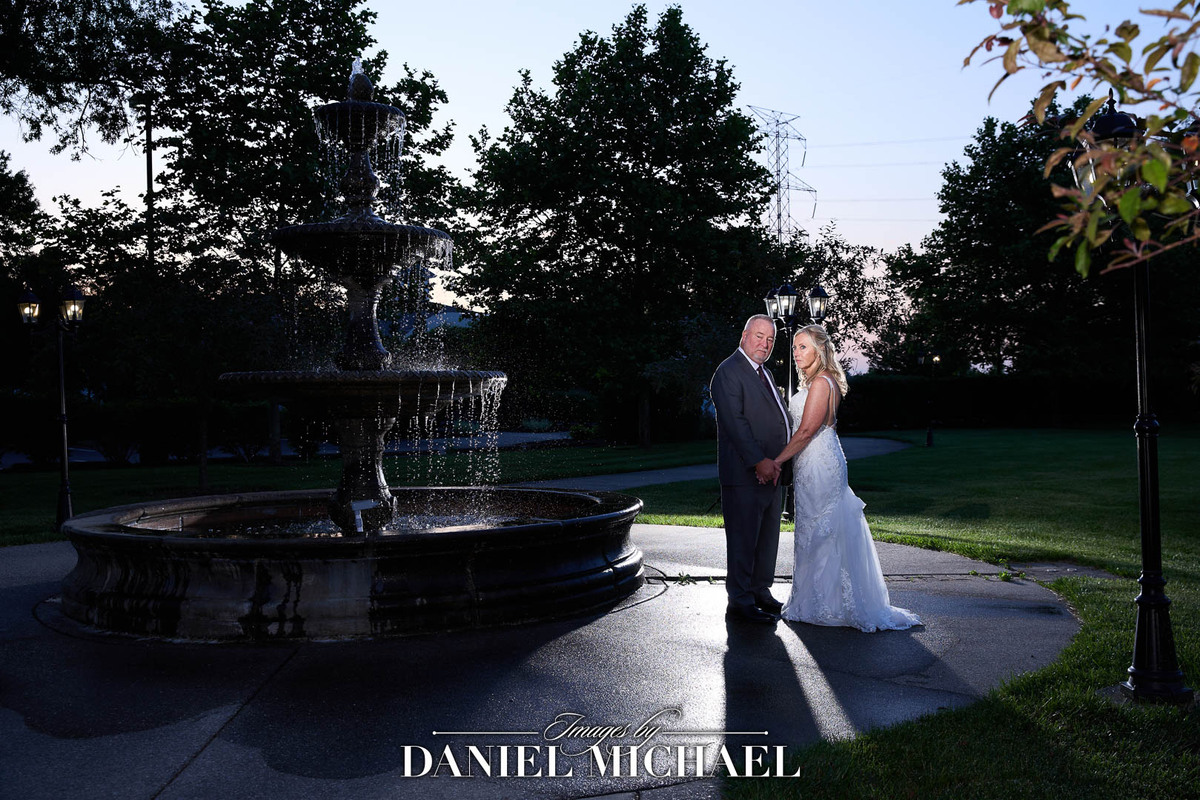 Julie and Tom next to fountain
